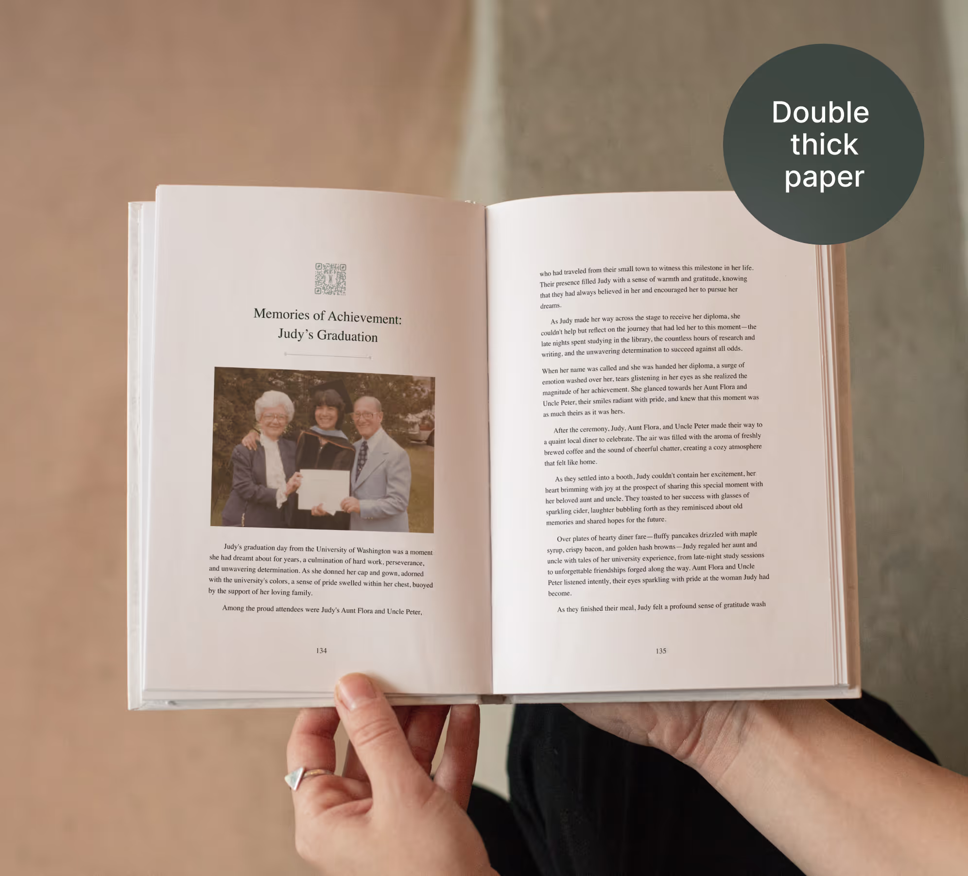 A picture of the Remento book opened on a story. The first page has a QR code, a title, and a photo